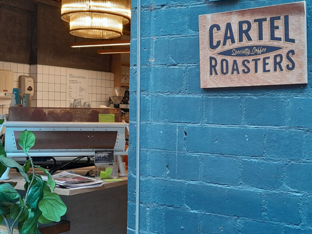 Blue Doors on Somerset Place in Melbourne, proudly displaying their use of Cartel Roasters beans